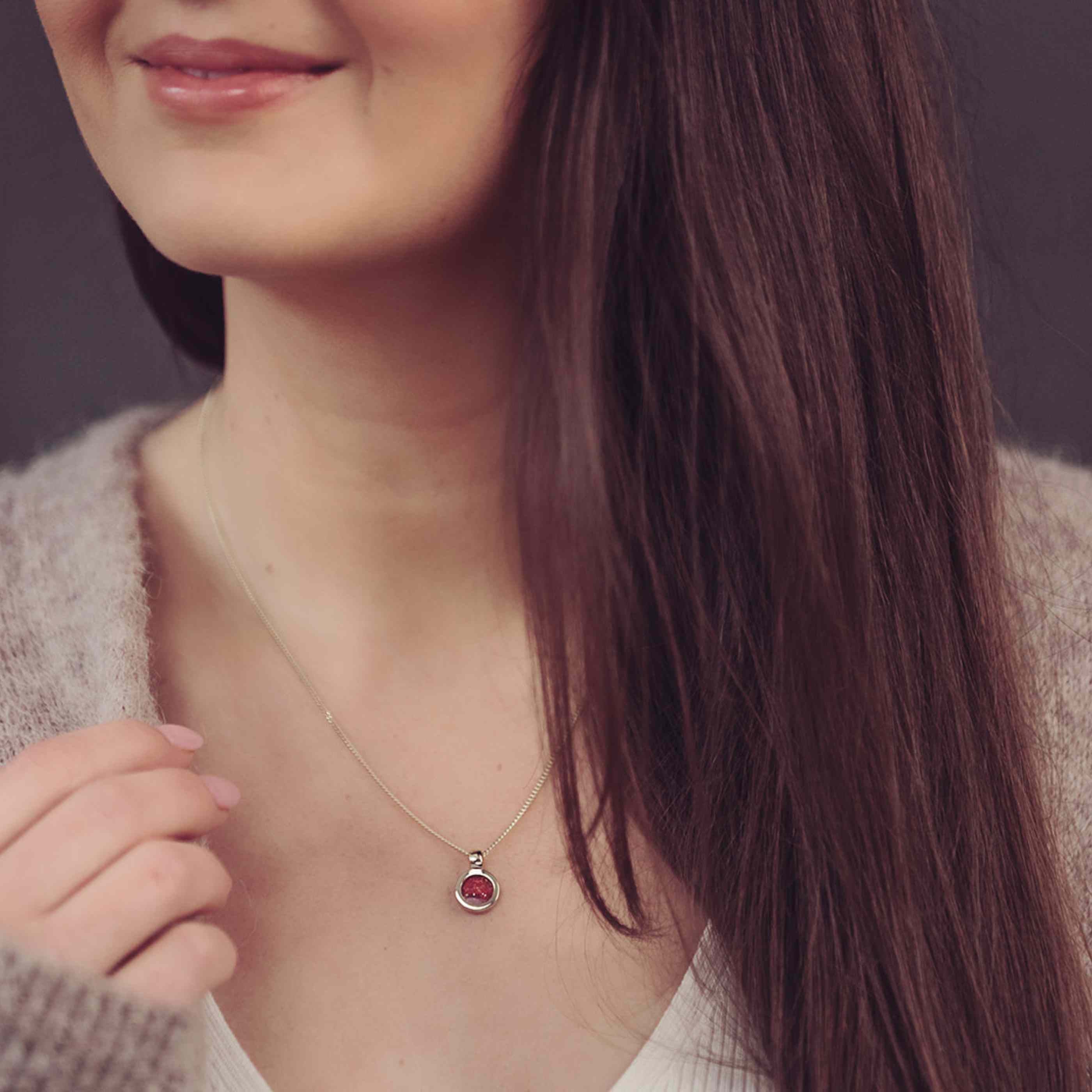 Red Gold Ashes Necklace being worn on woman