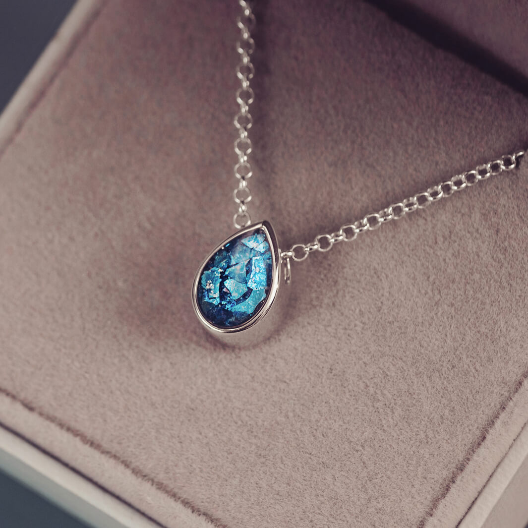 Peardrop shaped silver pendant, filled with blue crystal & cremation ashes, on a silver chain