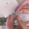 video demonstrating how to unscrew the silver ring and add in the cremation ashes