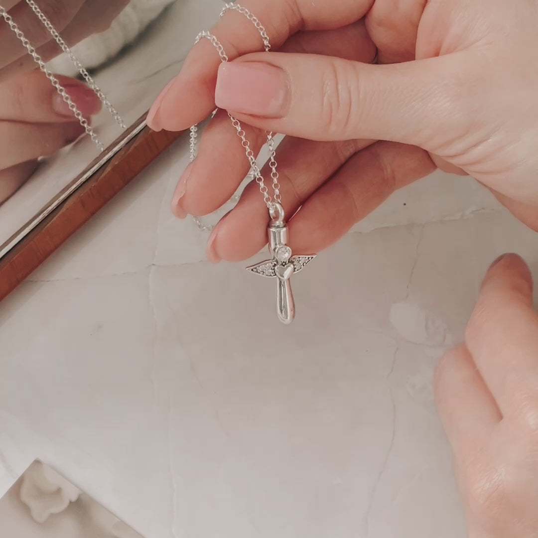 Video showing how to add ashes into the Angel wing necklace using a small funnel 