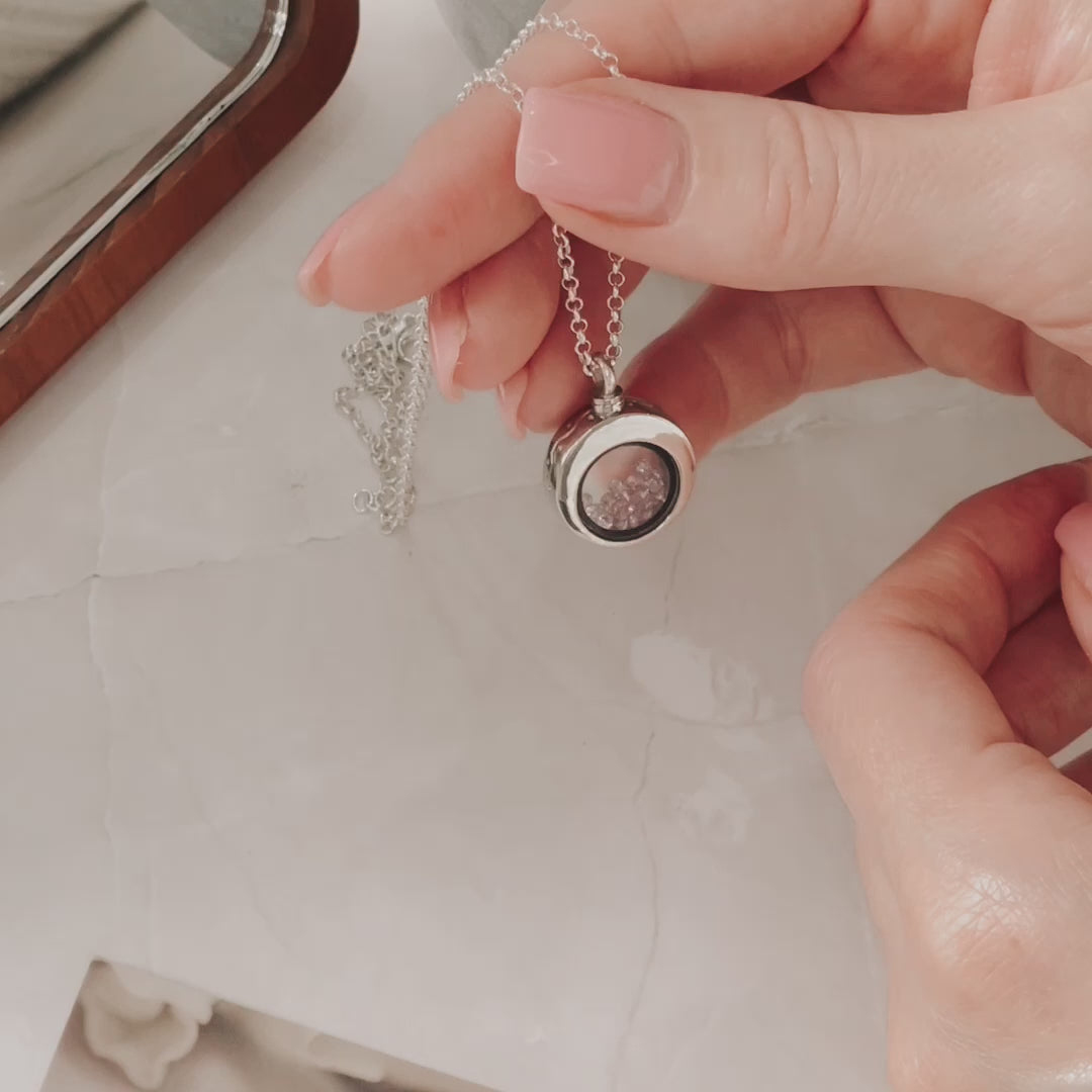 Video showing ashes being put into pendant in necklace with funnel 