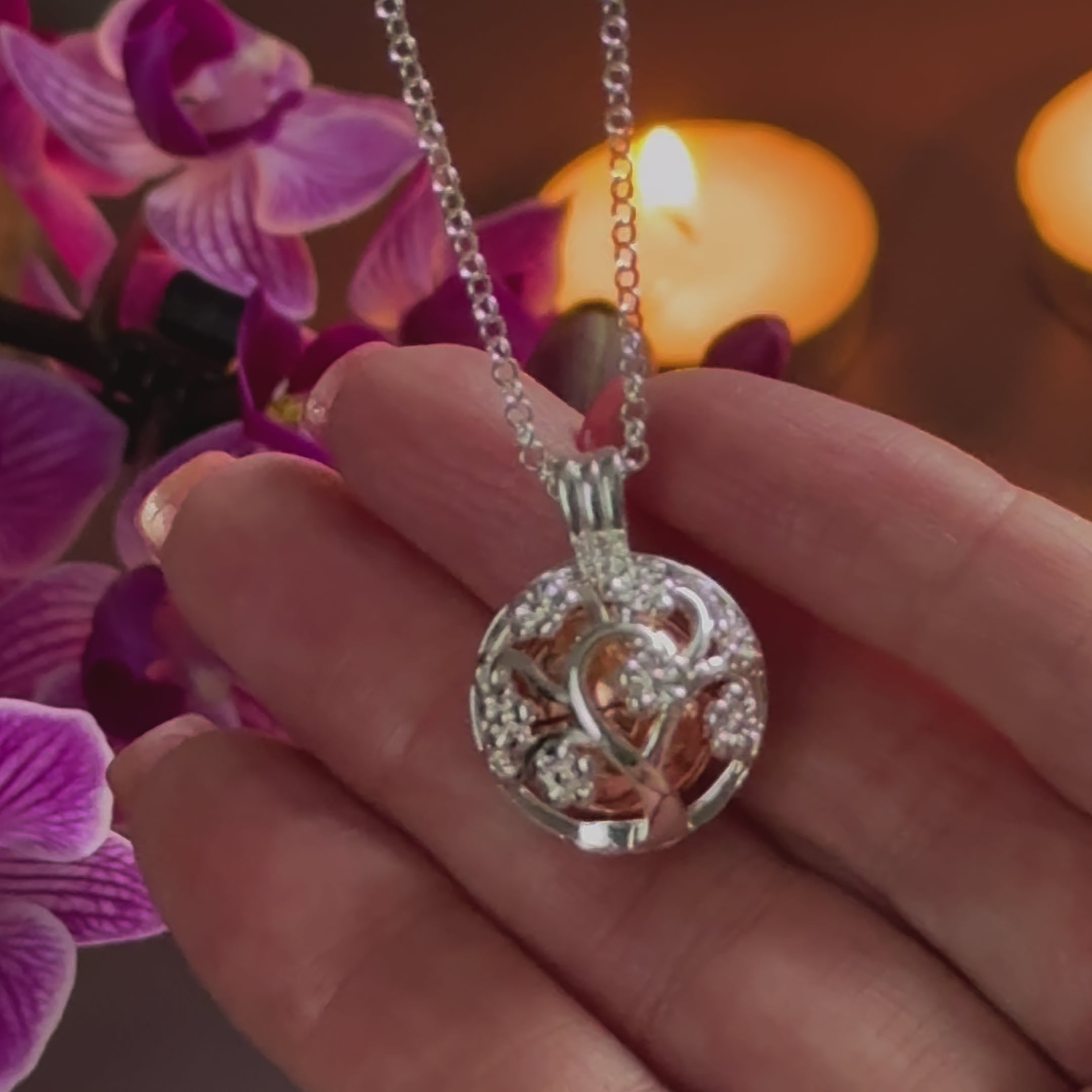 Demonstrating adding cremation ashes to a round family tree necklace 